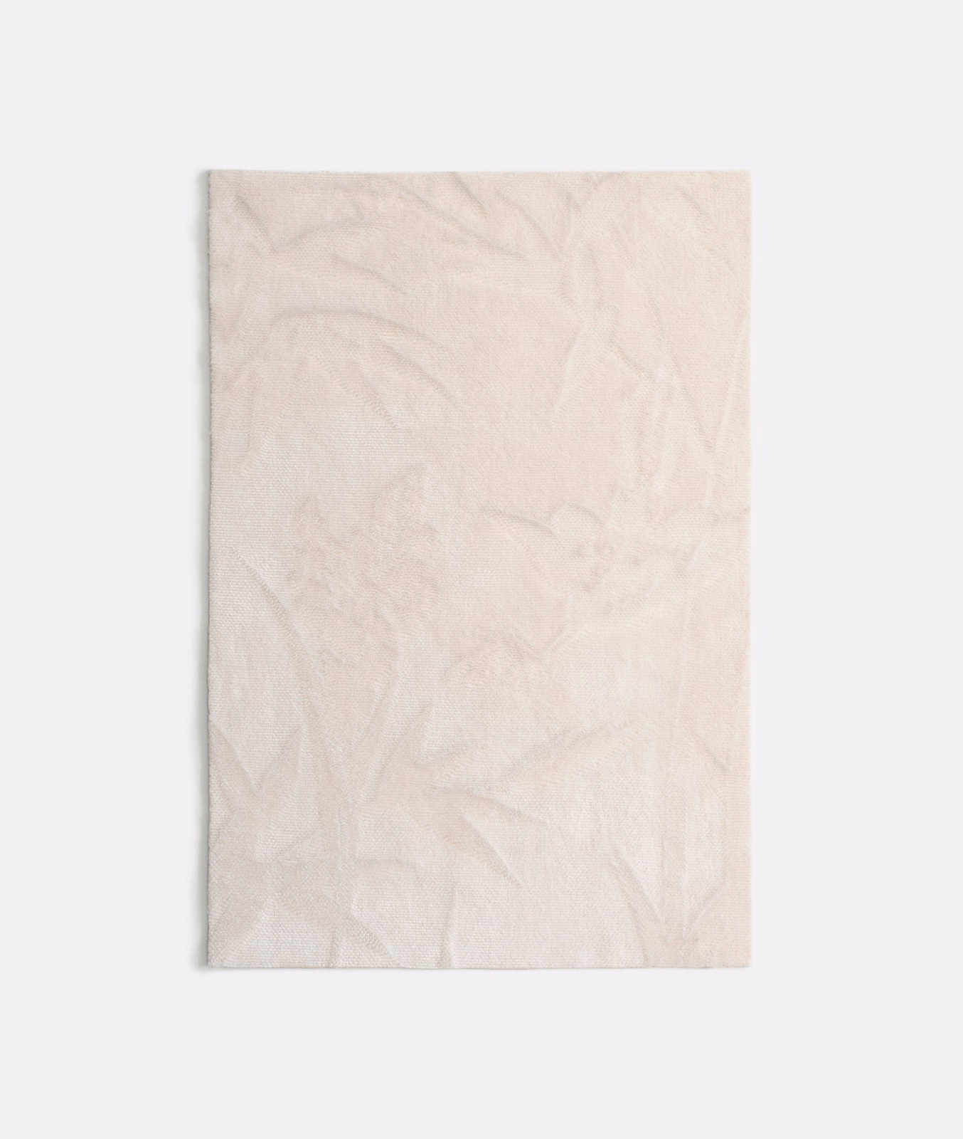 Pale ivory velvet with barely visible botanical leaves and softly shifting nap