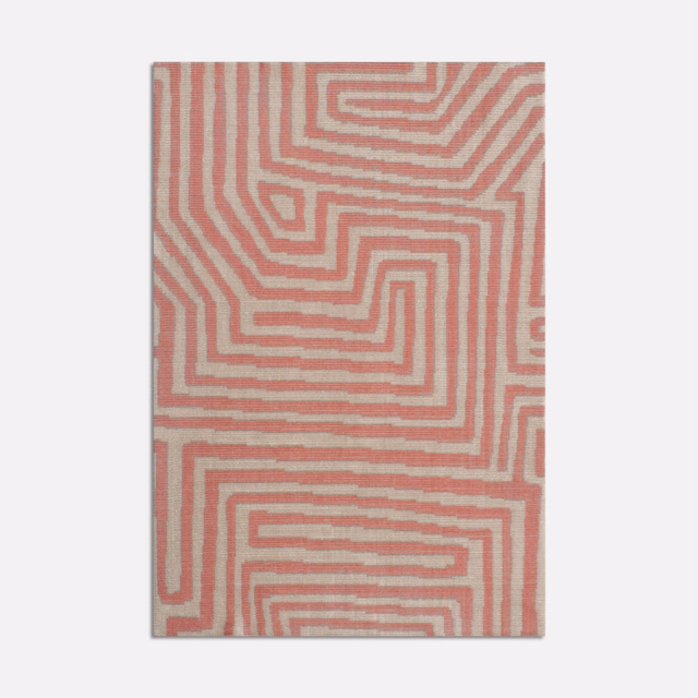 Dusty flamingo pink velvet with cream maze lines and a softly textured surface