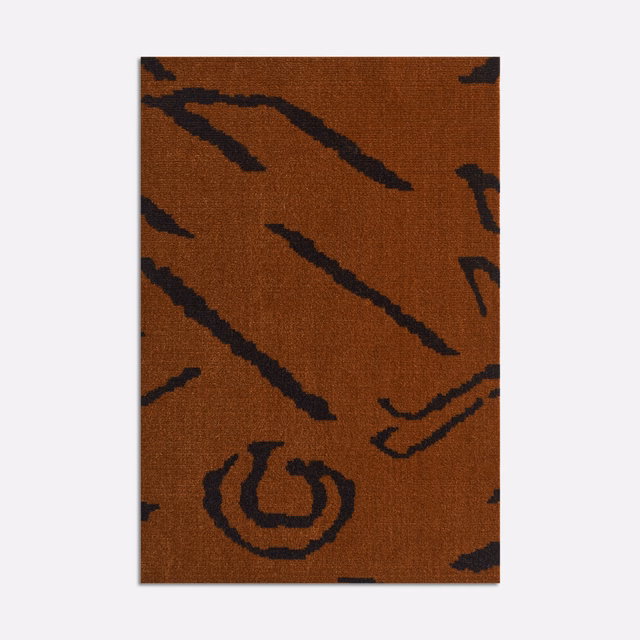 Burnt rust velvet with bold near-black diagonal tiger-like marks and curved motifs