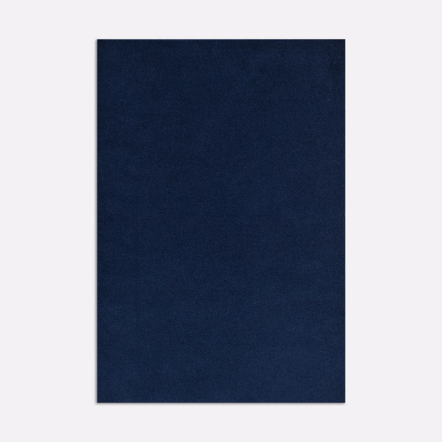 Deep ink navy velvet swatch showing subtle directional nap and tonal shading
