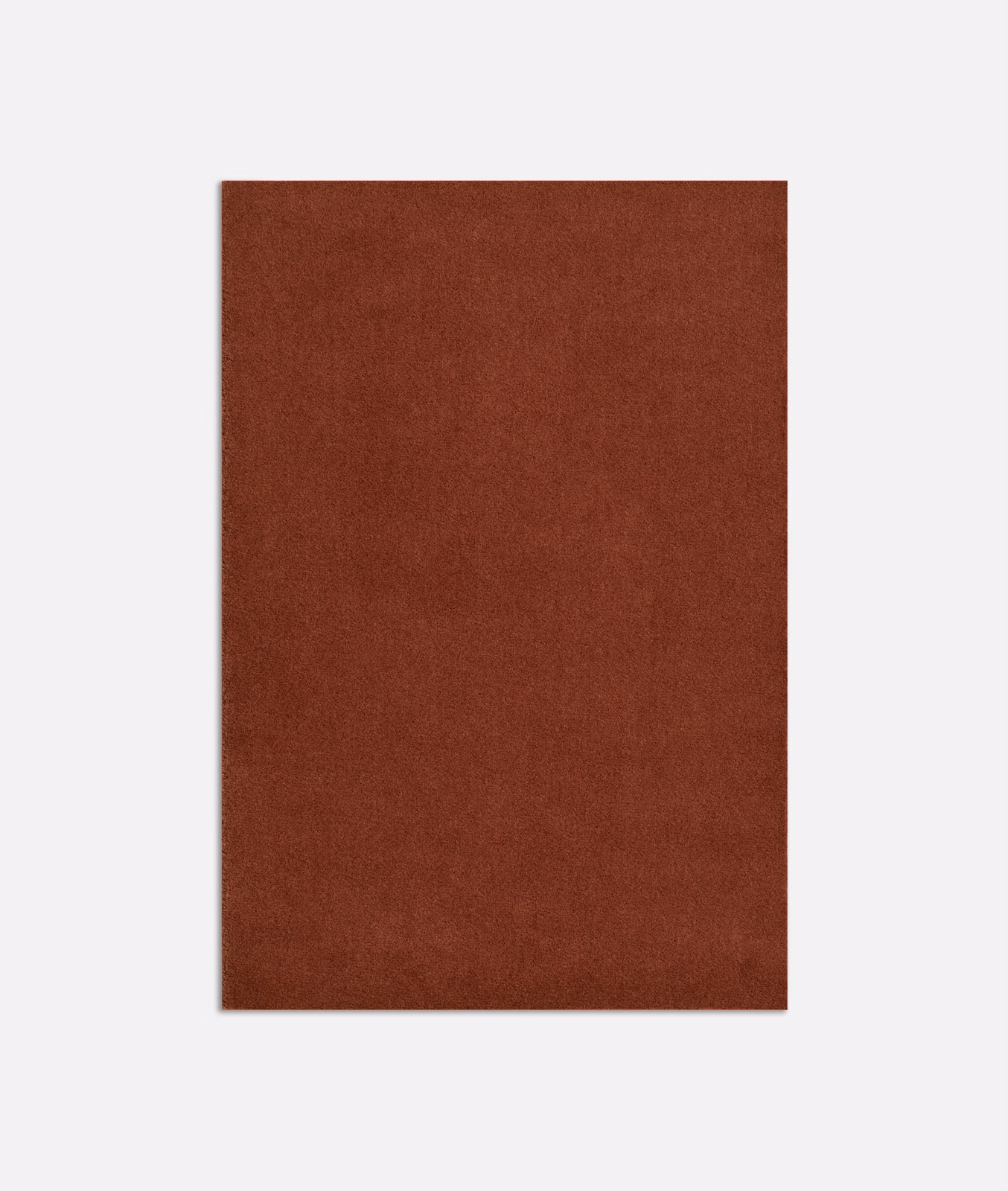 Deep rust-terracotta velvet swatch with a subtly mottled, plain surface