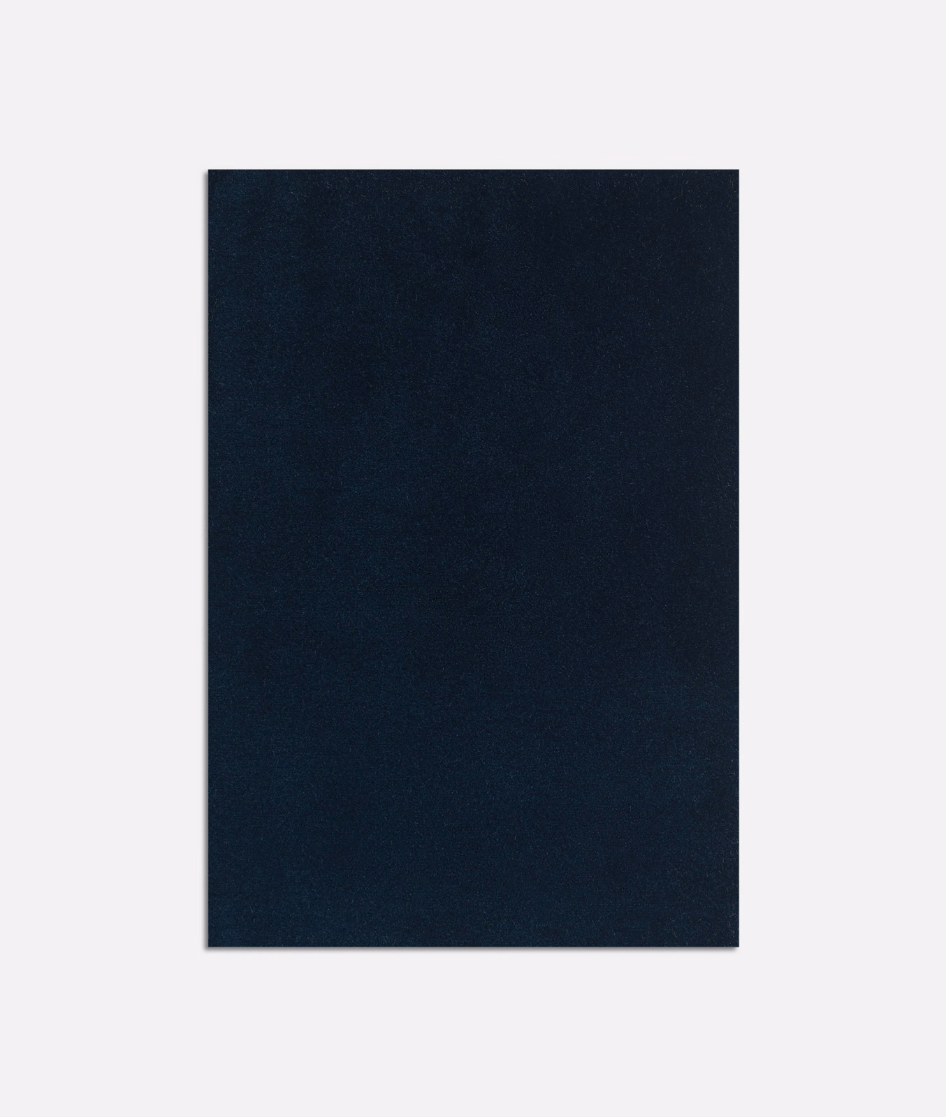 Near-black indigo velvet swatch with a softly shifting, light-catching nap