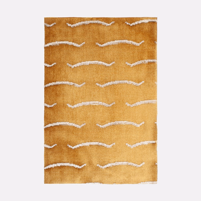Ochre-gold velvet with irregular warm-white horizontal wave motifs and softly brushed texture