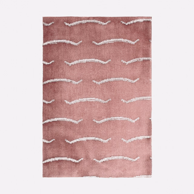 Dusty rose velvet swatch with irregular ivory horizontal wave motifs