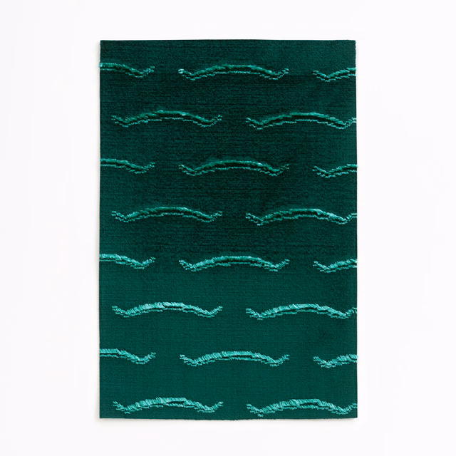 Deep malachite velvet with turquoise horizontal wave motifs and subtle ridged texture