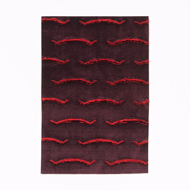 Deep burgundy velvet with raised scarlet wave rows and a subtly textured ground