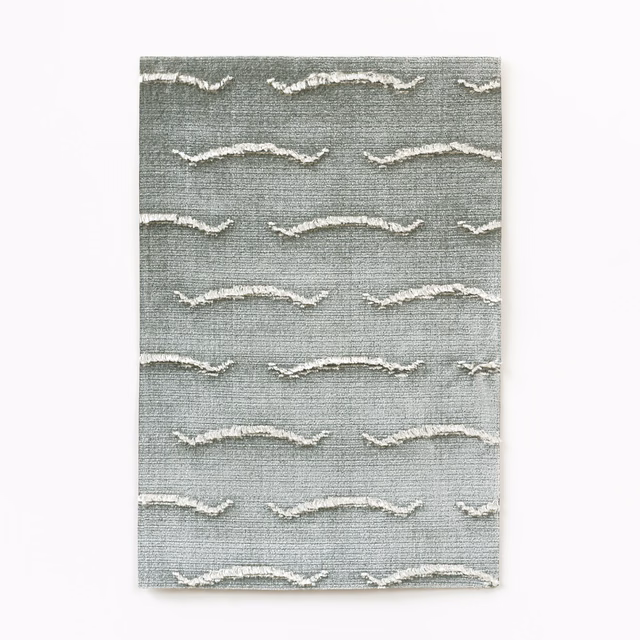 Silver-grey velvet swatch with irregular ivory wave bands and fine horizontal texture