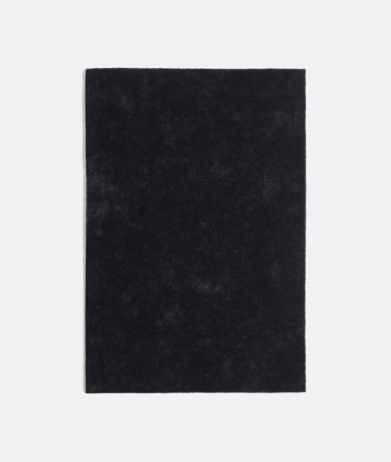 Deep charcoal-black velvet swatch with softly mottled nap and subtle smoky highlights