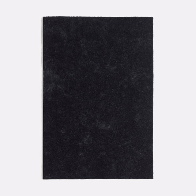 Deep charcoal-black velvet swatch with softly mottled nap and subtle smoky highlights