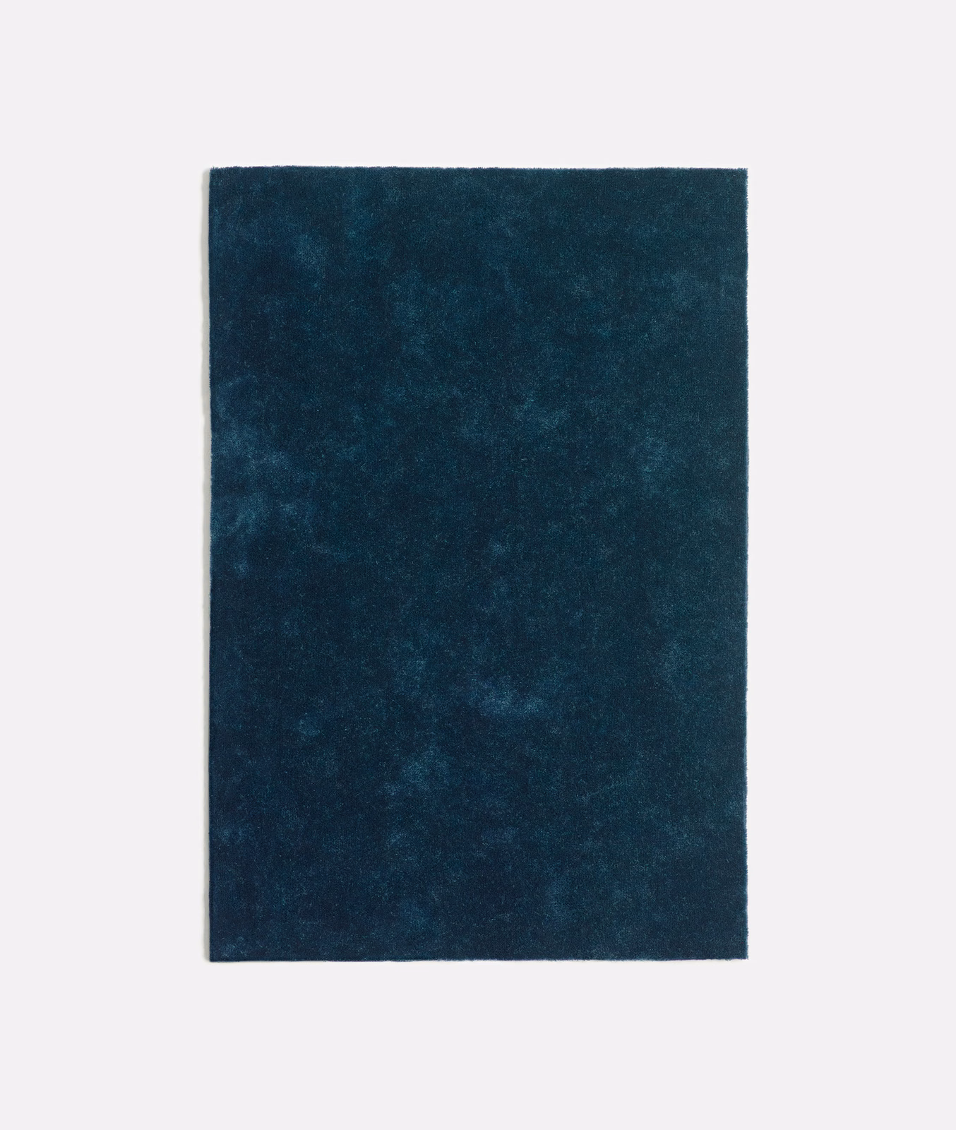 Deep indigo velvet swatch with softly mottled, blue-toned nap