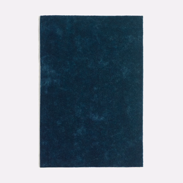 Deep indigo velvet swatch with softly mottled, blue-toned nap
