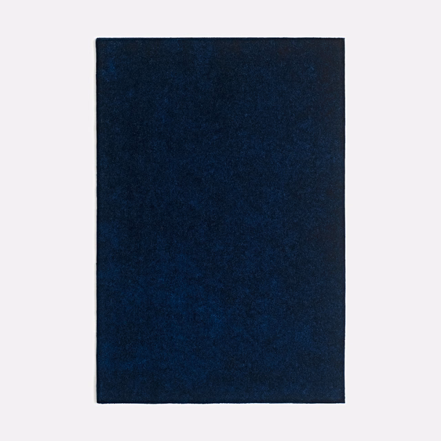 Deep navy velvet swatch with a softly mottled, light-catching plush pile