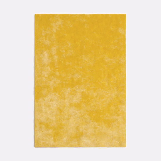 Warm mustard-yellow velvet swatch with a softly mottled, clouded nap