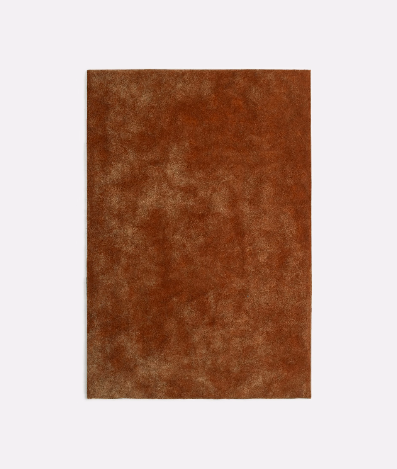 Rust-brown Nuvolari Tabacco velvet swatch with softly clouded, mottled nap