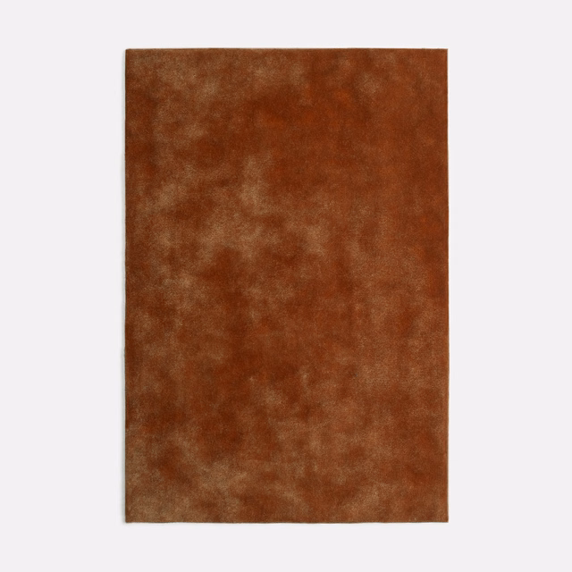 Rust-brown Nuvolari Tabacco velvet swatch with softly clouded, mottled nap