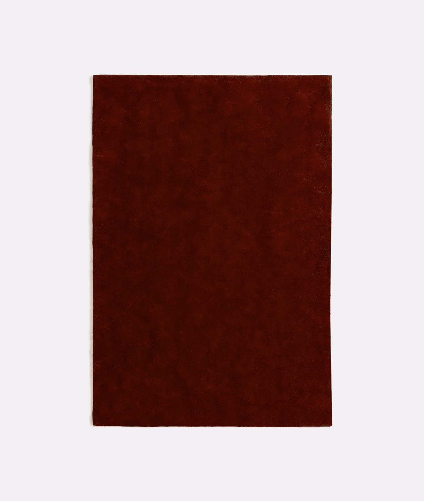 Deep oxblood-red velvet swatch with subtle mottled nap and dark burgundy shading
