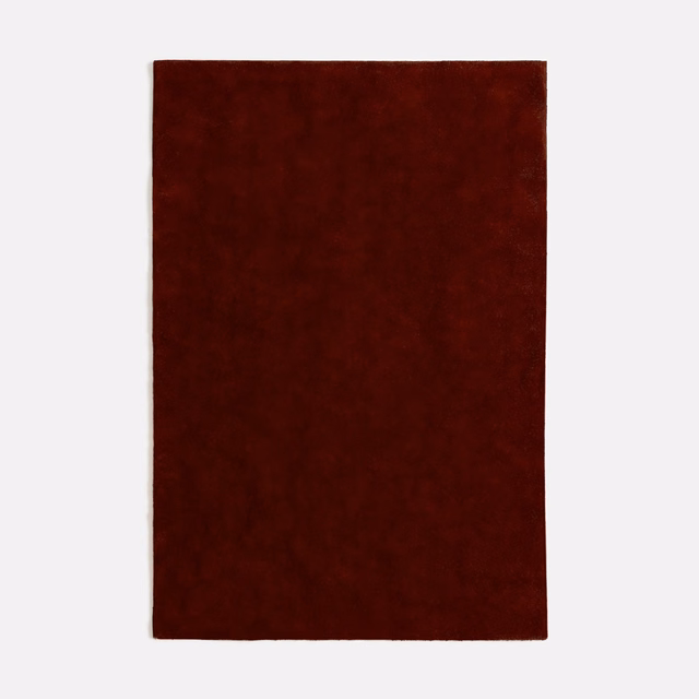 Deep oxblood-red velvet swatch with subtle mottled nap and dark burgundy shading
