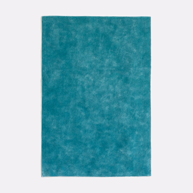 Saturated turquoise-teal velvet with cloudy mottling and a softly light-catching nap