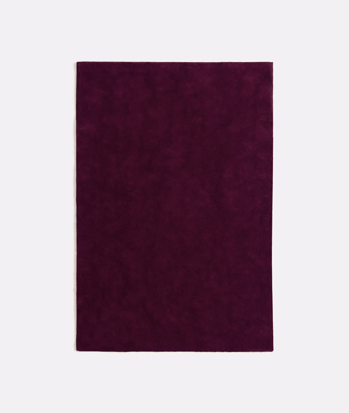 Deep plum-purple velvet swatch with subtle nap shifts and a softly mottled surface