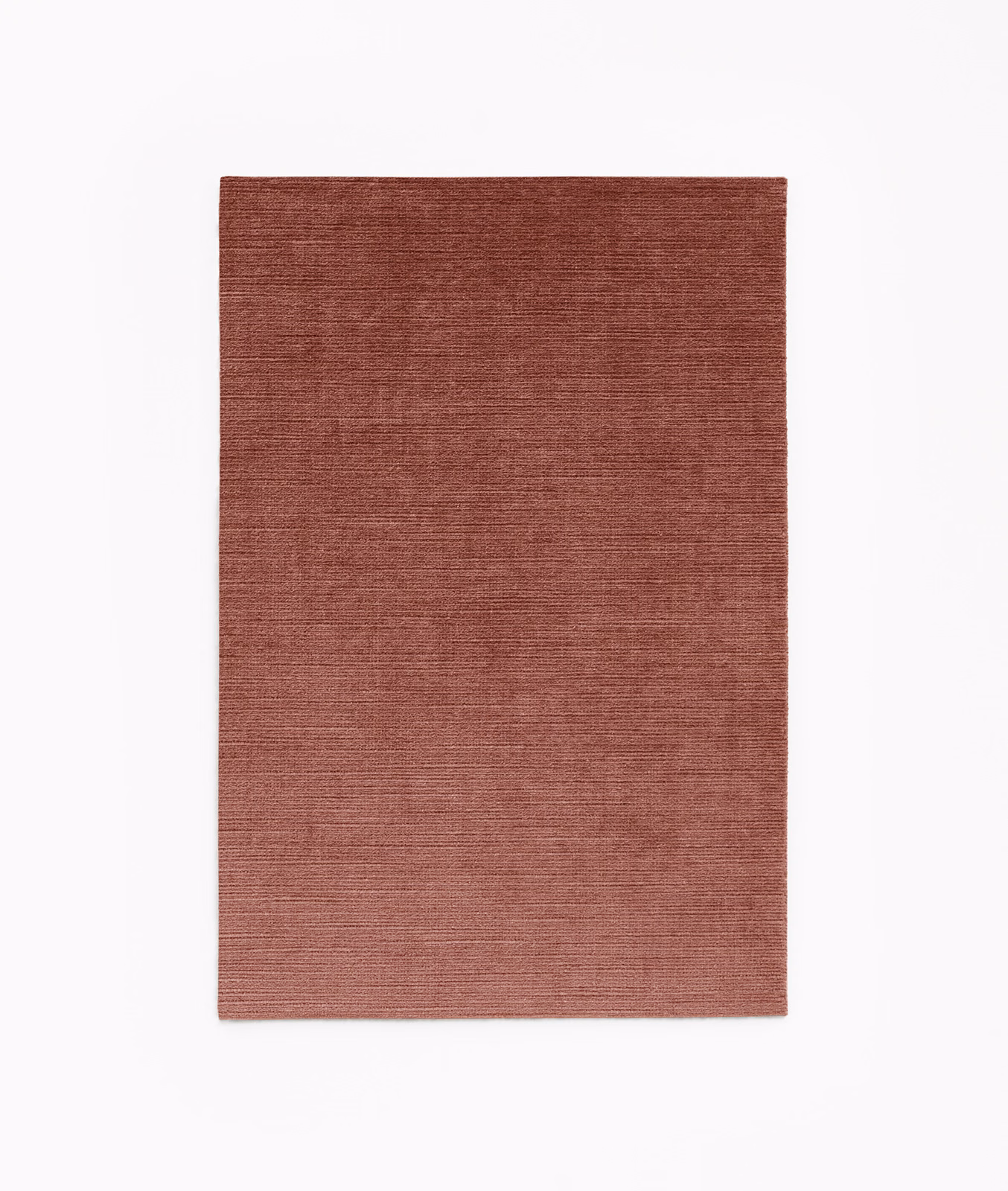 Muted brick-blush velvet swatch with fine horizontal striated texture