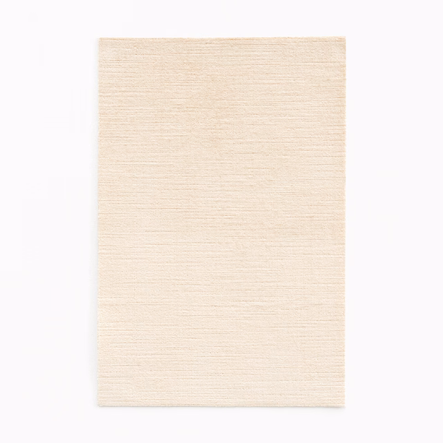 Warm ivory velvet swatch with fine horizontal striations and softly shaded surface