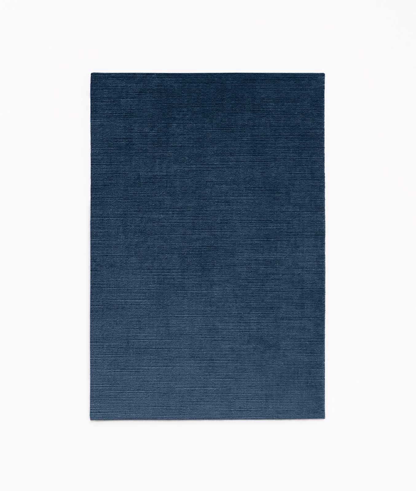 Deep navy velvet swatch with subtle horizontal grain and a low-sheen surface