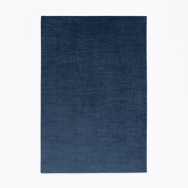 Deep navy velvet swatch with subtle horizontal grain and a low-sheen surface