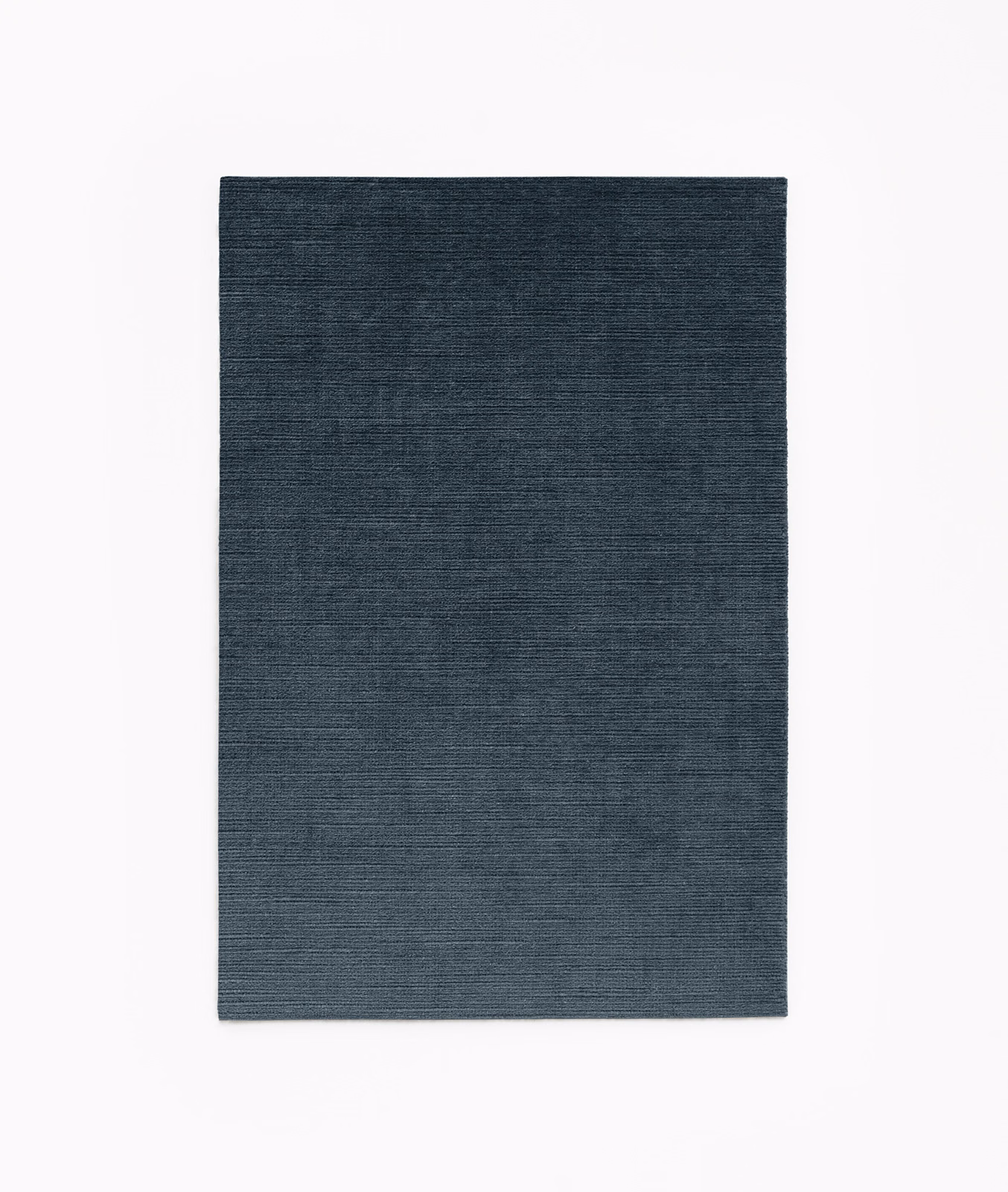 Deep blue-grey velvet with subtle horizontal texture and a low smoky sheen