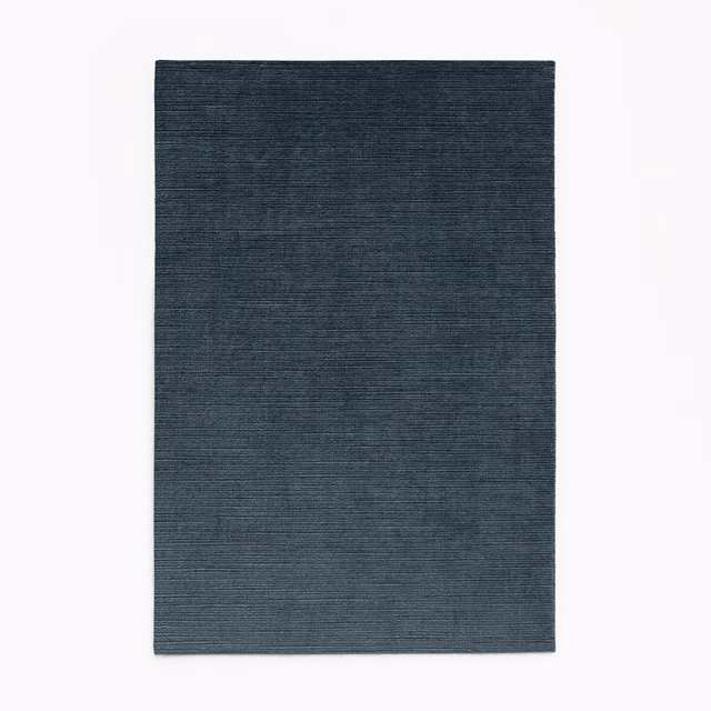 Deep blue-grey velvet with subtle horizontal texture and a low smoky sheen