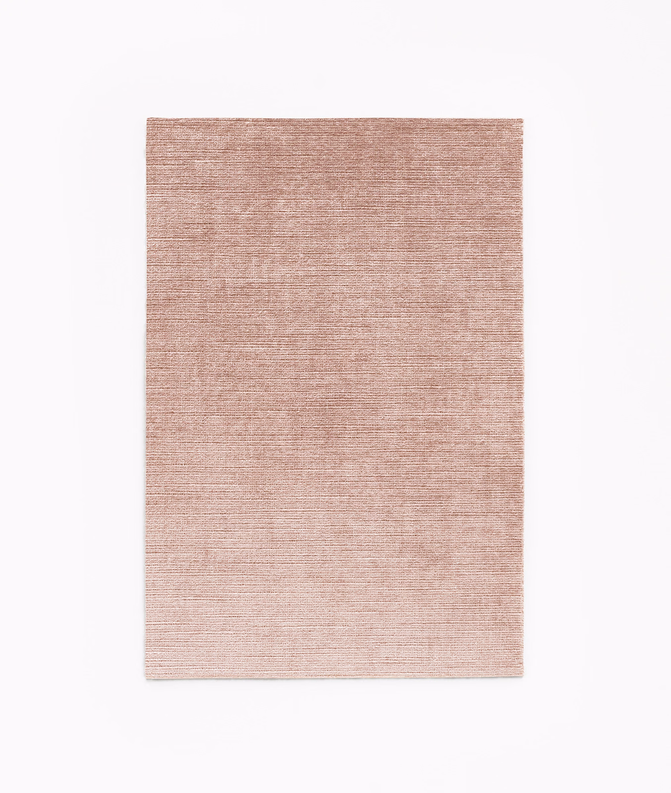 Muted dusty rose velvet swatch with fine horizontal striations and soft tonal depth