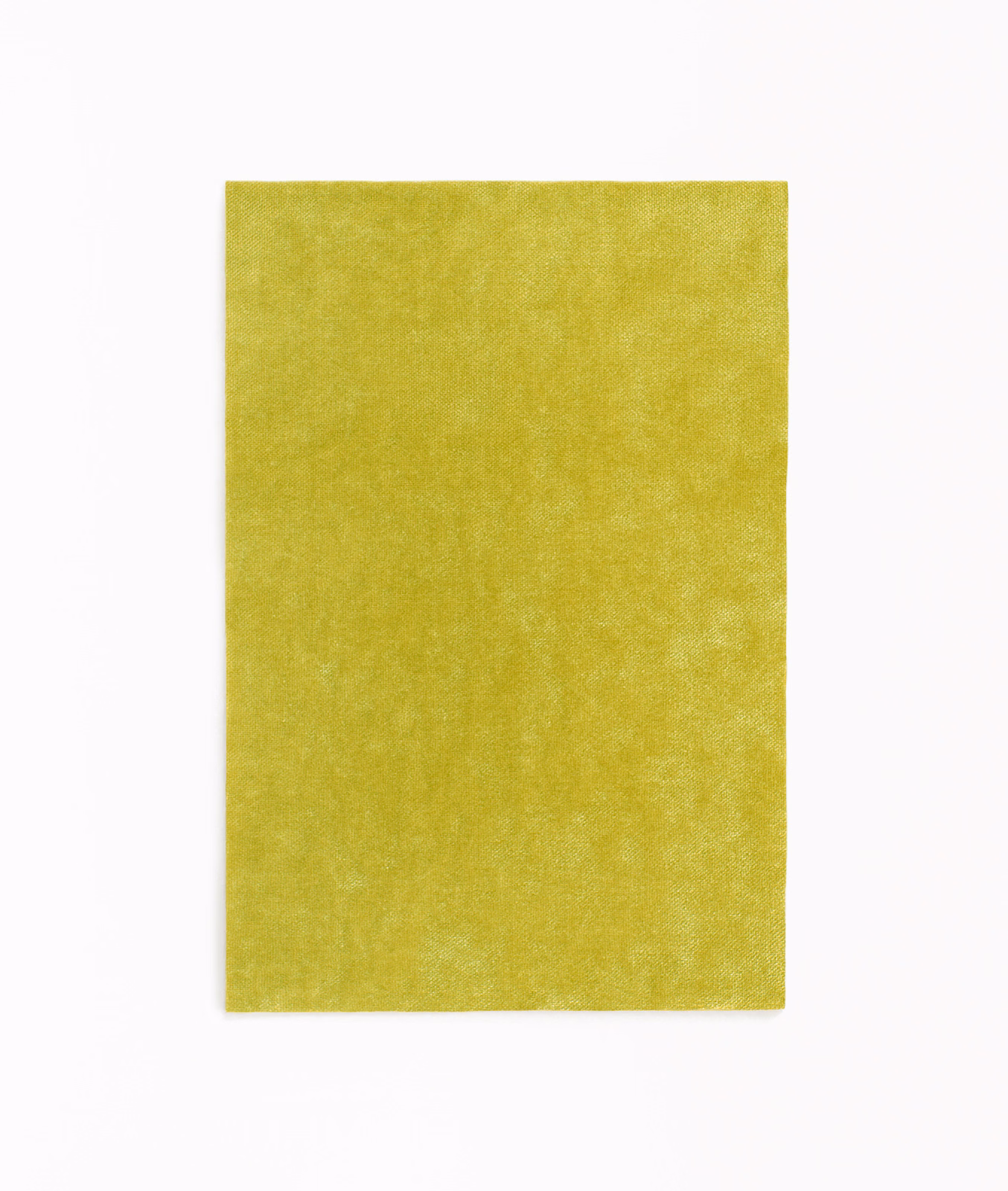 Vivid absinthe-green velvet swatch with softly mottled, light-catching pile