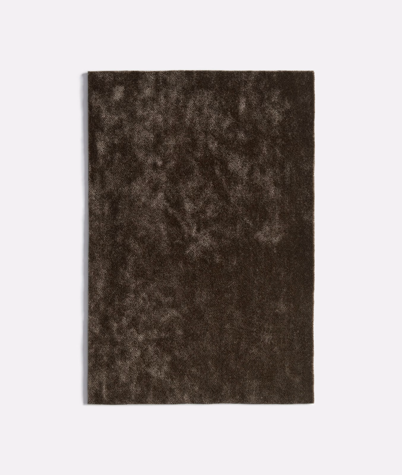 Dark antracite velvet swatch with mottled brown-charcoal pile and soft light-catching texture