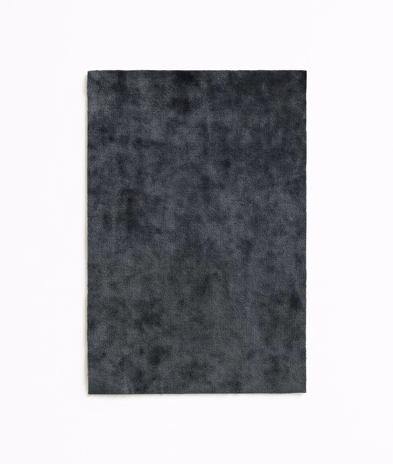 Deep charcoal grey velvet swatch with a softly mottled, light-catching pile
