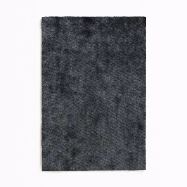 Deep charcoal grey velvet swatch with a softly mottled, light-catching pile