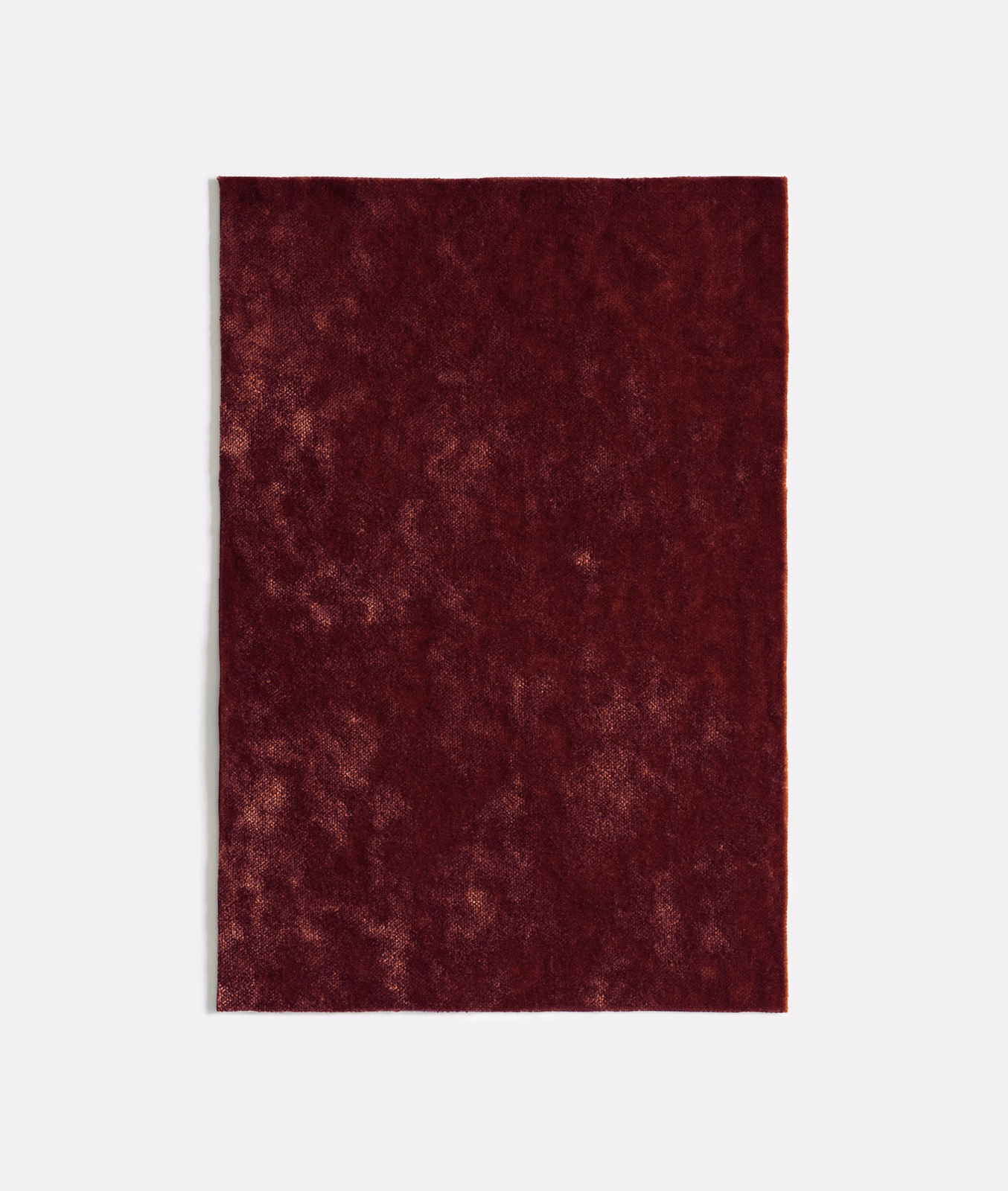 Deep bordeaux velvet swatch with softly mottled, light-catching pile