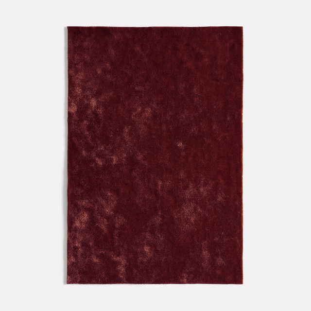 Deep bordeaux velvet swatch with softly mottled, light-catching pile