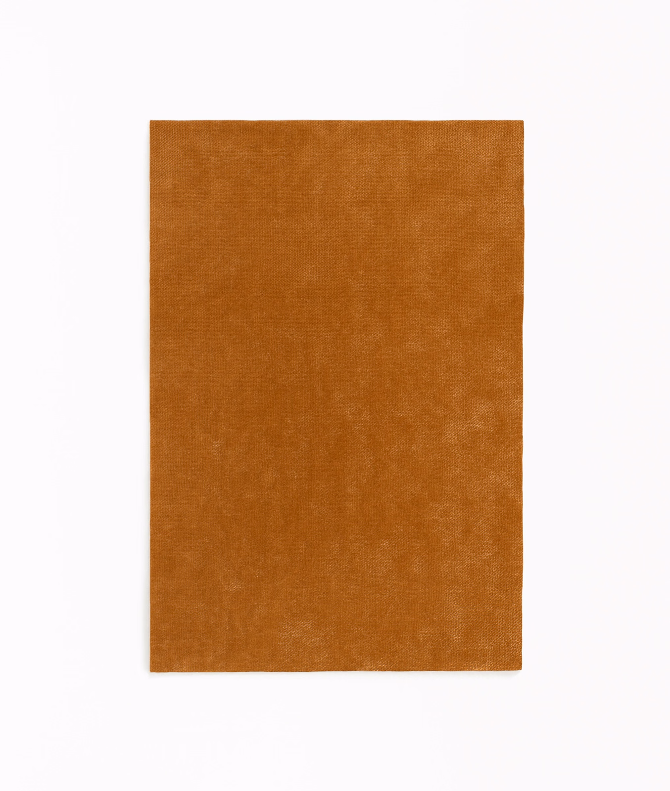 Warm cognac-brown velvet swatch with softly mottled nap and subtle tonal variation