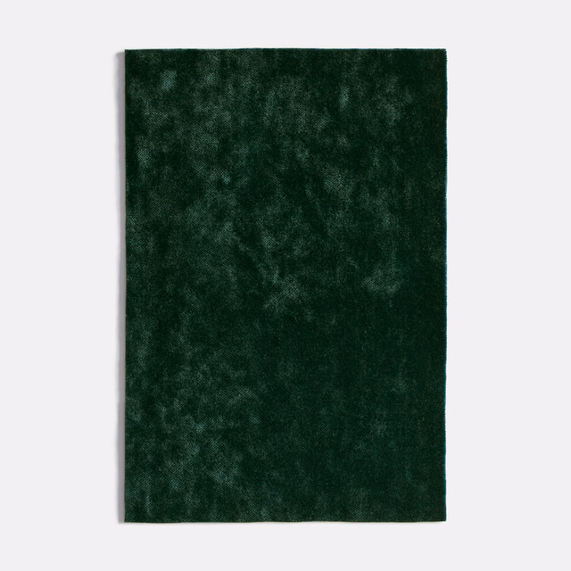 Deep forest-green velvet with softly mottled, shadowed pile texture