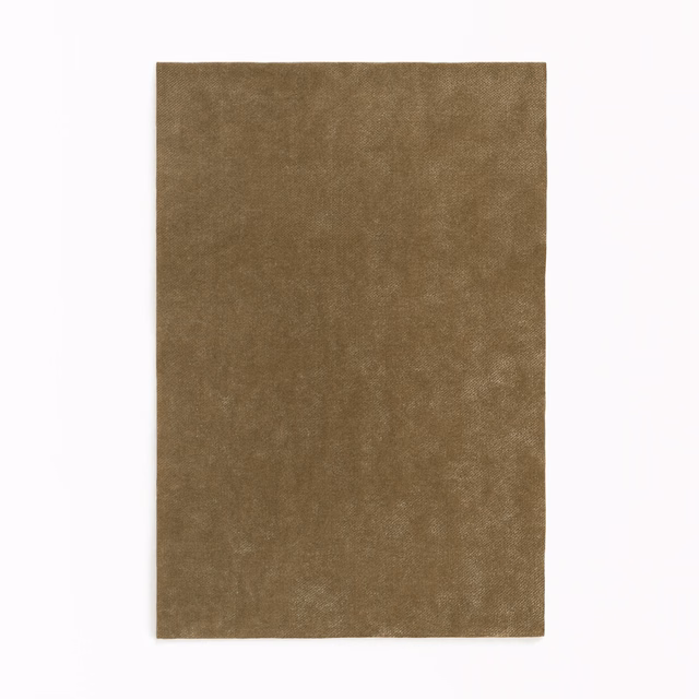 Mottled lichen-brown velvet swatch with softly shifting, light-catching nap