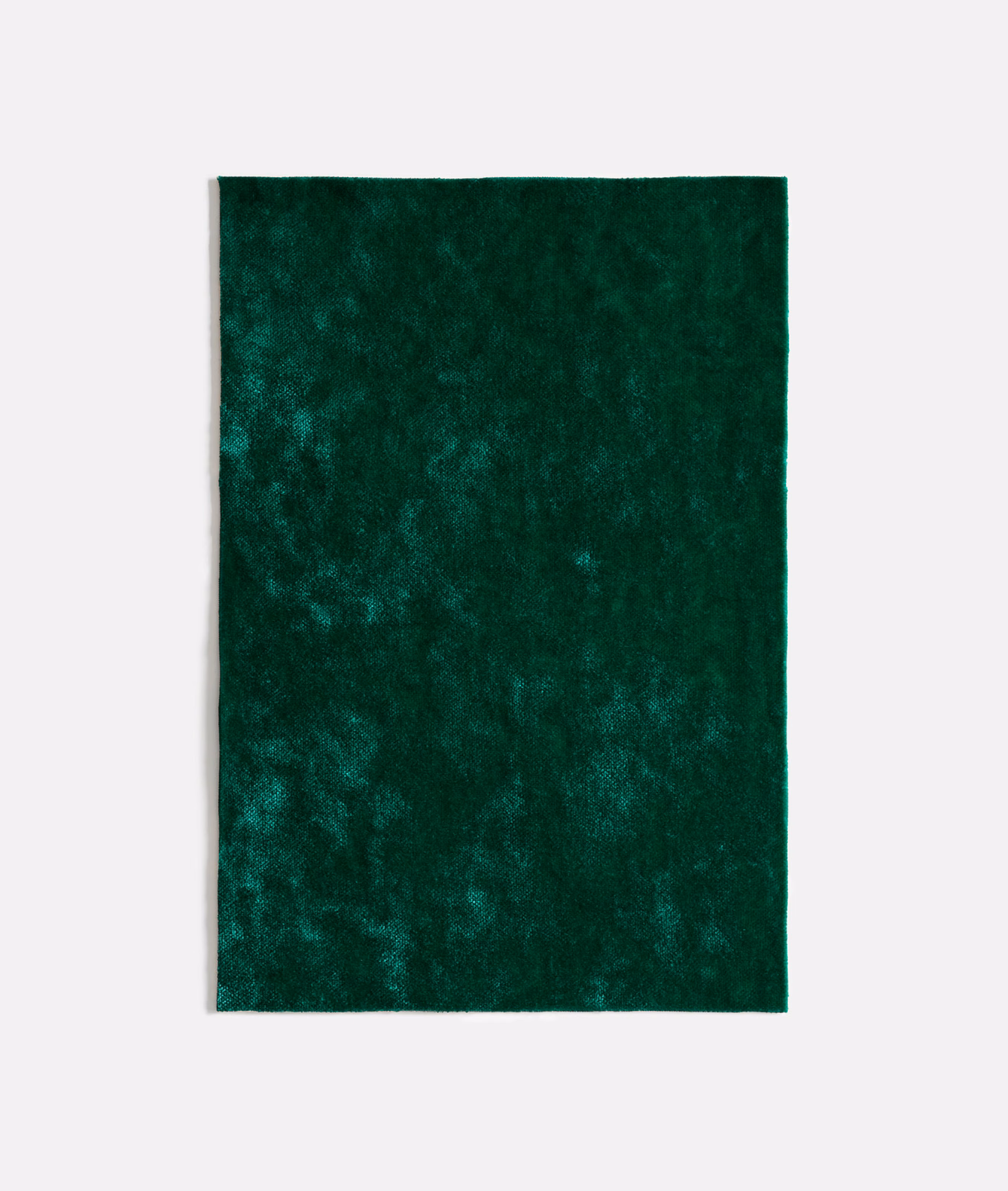 Deep malachite-green velvet with cloudy, light-catching pile and plush texture