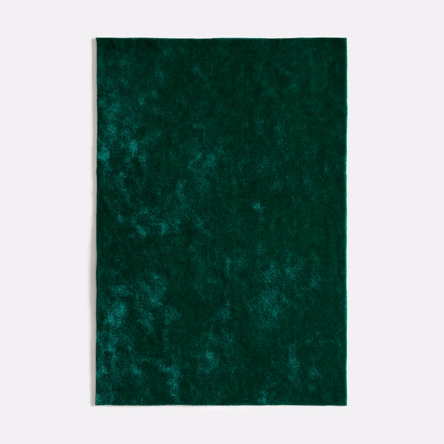 Deep malachite-green velvet with cloudy, light-catching pile and plush texture