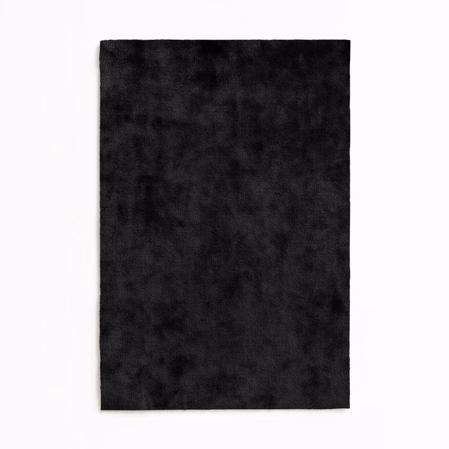 Near-black velvet swatch with softly mottled charcoal pile and subtle tonal shading