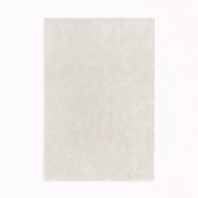 Pale ivory velvet swatch with a softly mottled plush surface