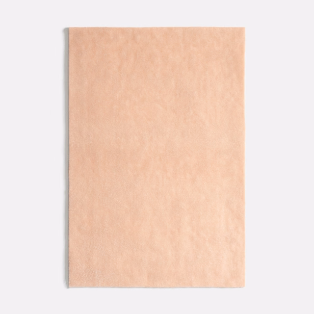 Pale peach nude velvet swatch with softly mottled, light-catching pile