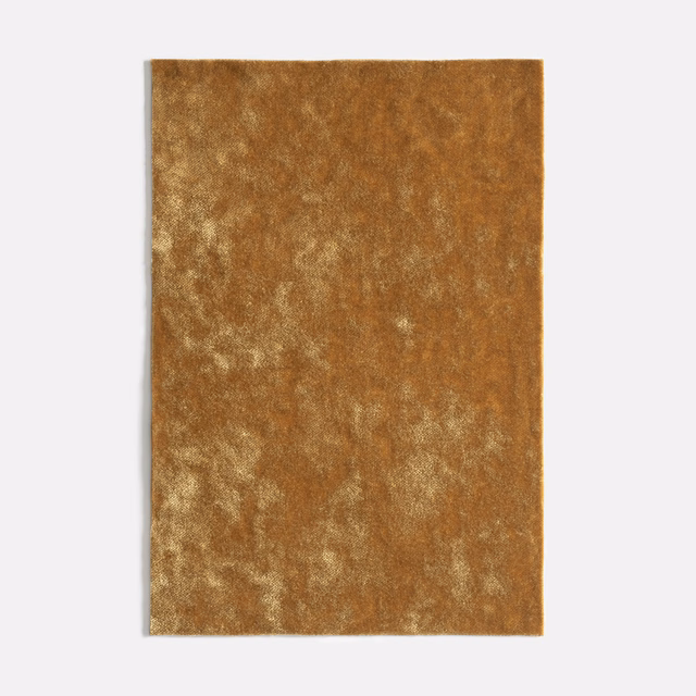 Warm antique-gold velvet swatch with cloudy, plush tonal variation
