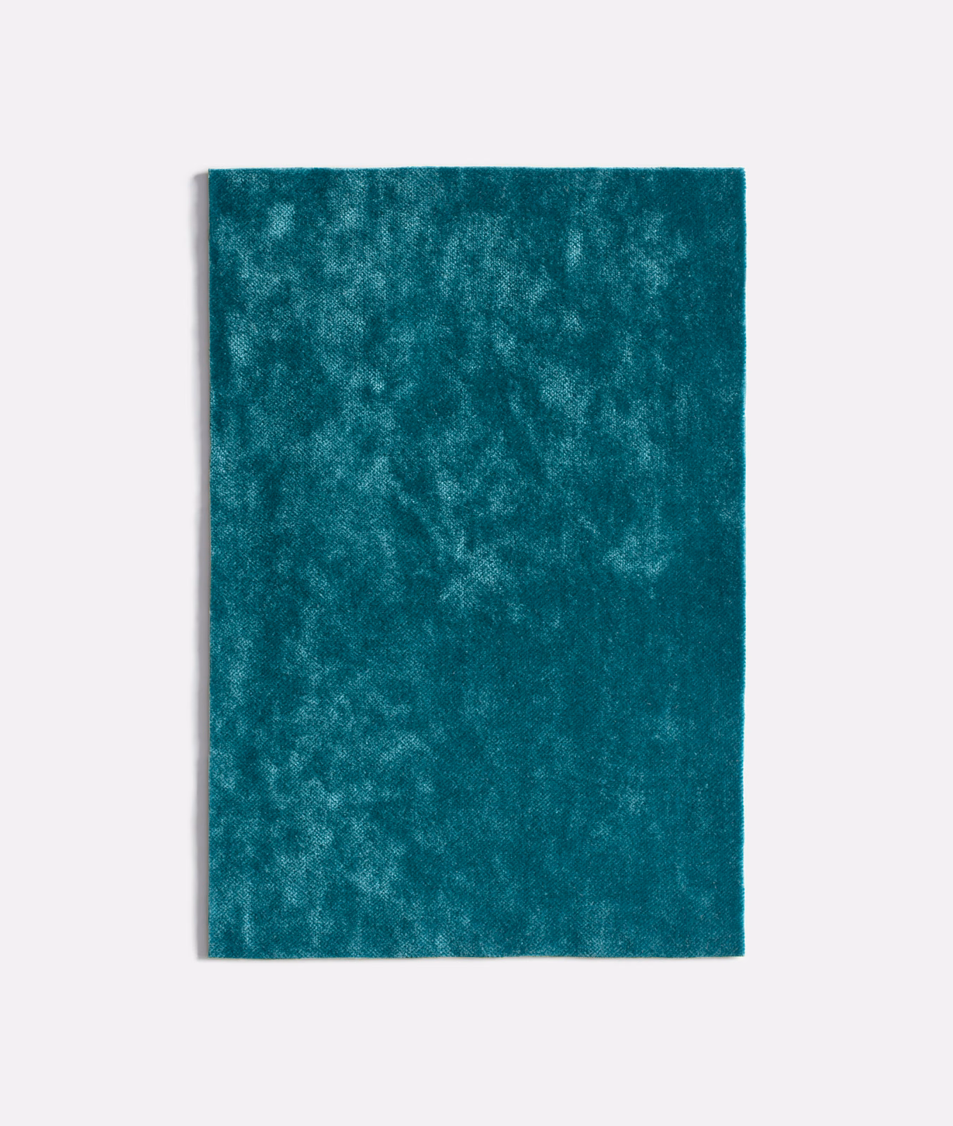 Deep turquoise teal velvet swatch with cloudy mottled nap and soft sheen