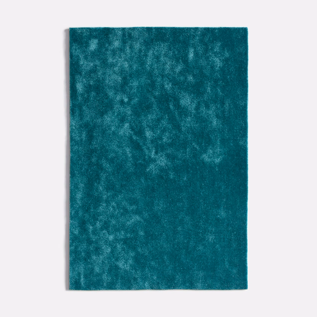 Deep turquoise teal velvet swatch with cloudy mottled nap and soft sheen