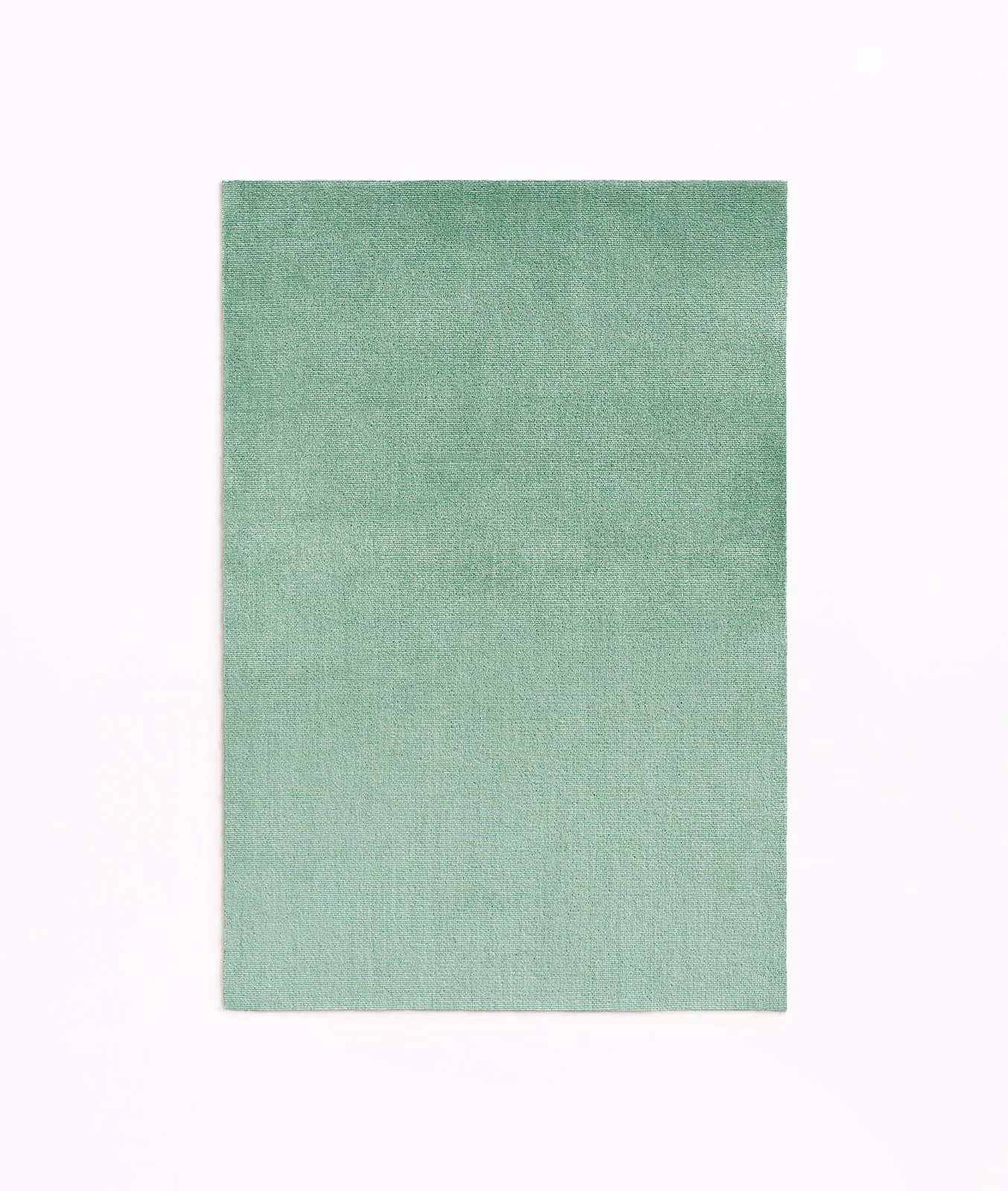 Pale mint-green velvet with a softly mottled, subtly textured surface