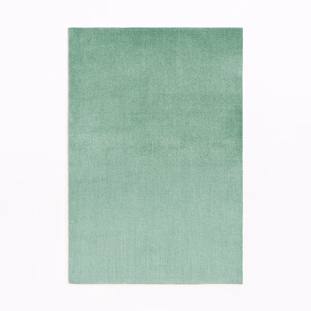 Pale mint-green velvet with a softly mottled, subtly textured surface
