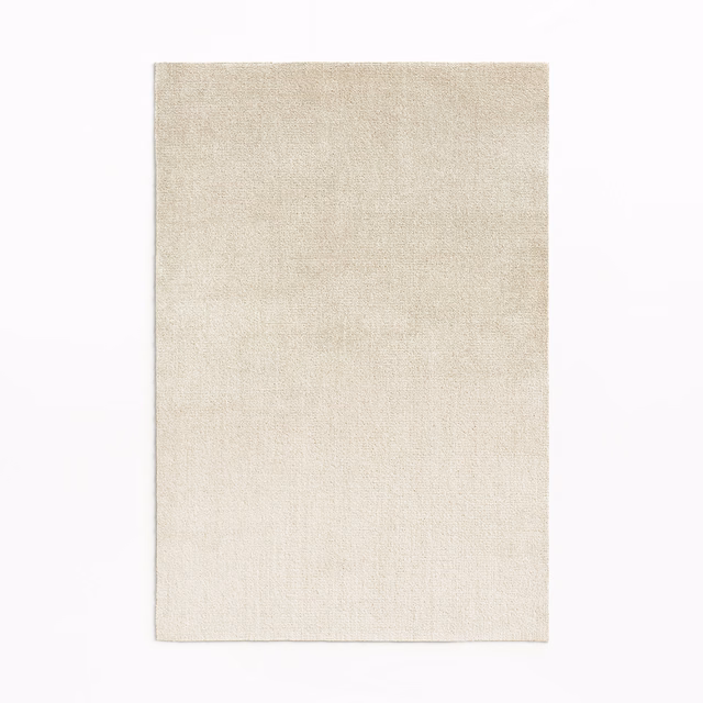 Pale ivory velvet swatch with subtle brushed texture and gentle tonal variation